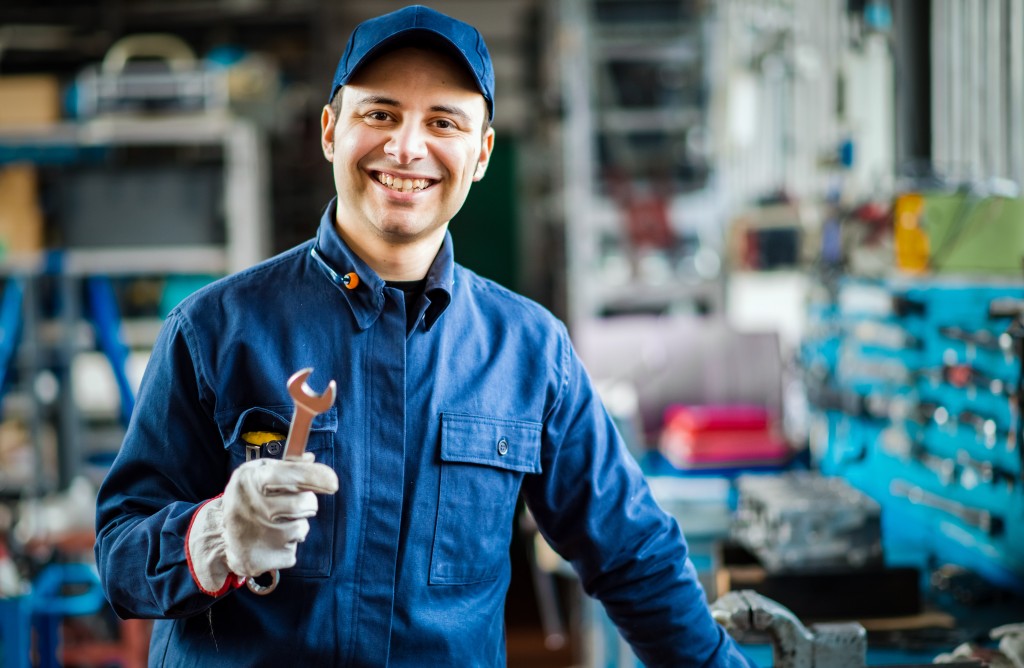 Auto mechanic in his garage