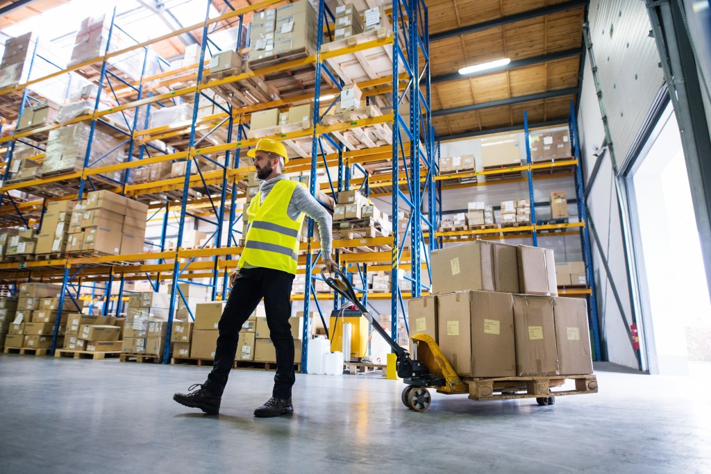 Warehouse personnel moving boxes