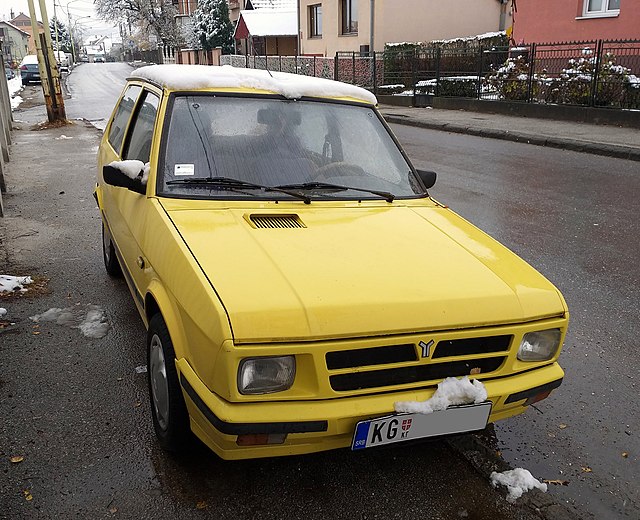 worst car the yugo in yellow